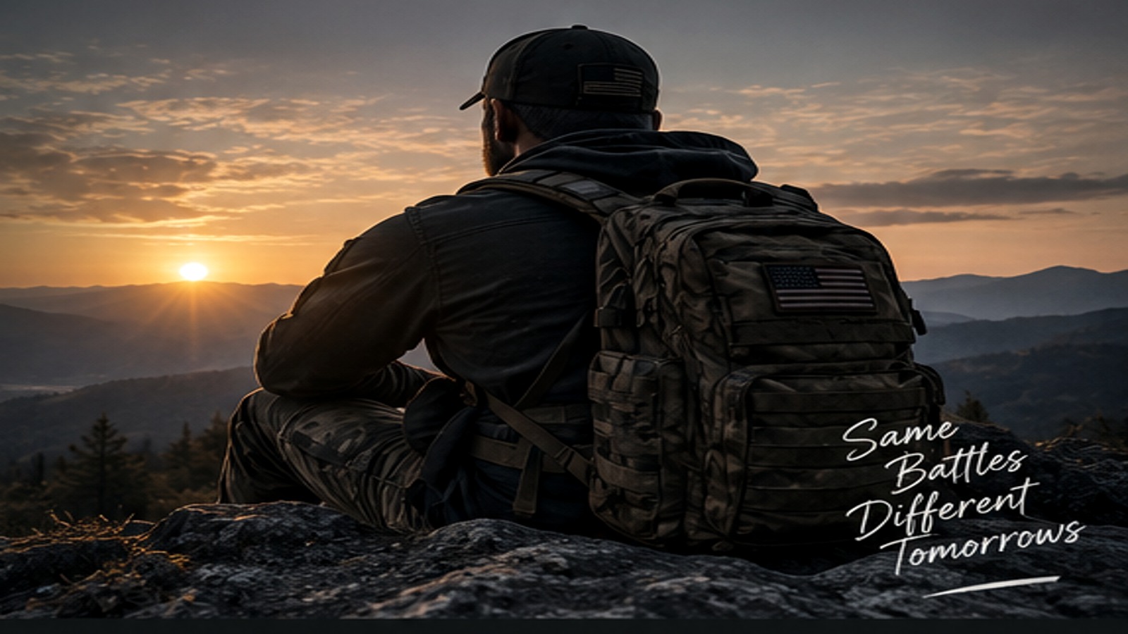 Veteran overlooking a mountain sunrise